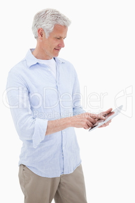 Portrait of a mature man using a tablet computer