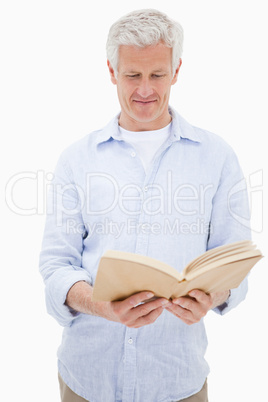 Portrait of a man reading a book