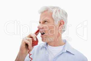 Angry man making a phone call