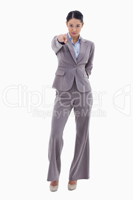 Portrait of a serious businesswoman pointing at the viewer