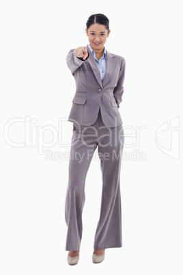 Portrait of a happy businesswoman pointing at the viewer