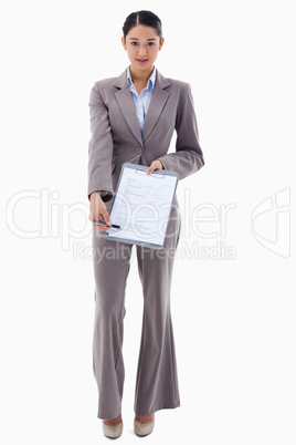 Portrait of a smiling businesswoman showing a contract