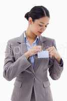 Portrait of a businesswoman clipping her badge