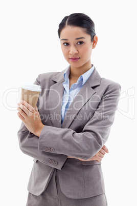 Portrait of a young businesswoman holding a takeaway tea
