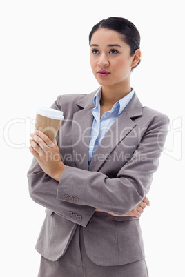 Portrait of a cute businesswoman holding a takeaway tea