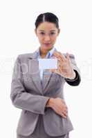 Portrait of a businesswoman showing a blank business card