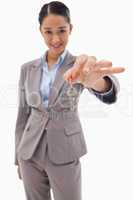 Portrait of a smiling businesswoman holding a key