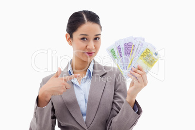 Businesswoman holding bank notes