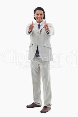 Portrait of an office worker posing with the thumbs up