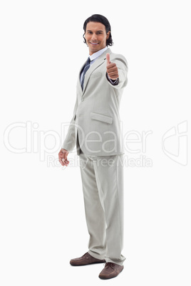 Portrait of an office worker posing with the thumb up