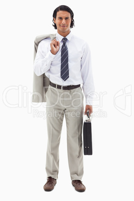 Portrait of an office worker holding his jacket over his shoulde