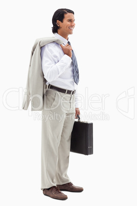 Portrait of a smiling office worker holding his jacket over his