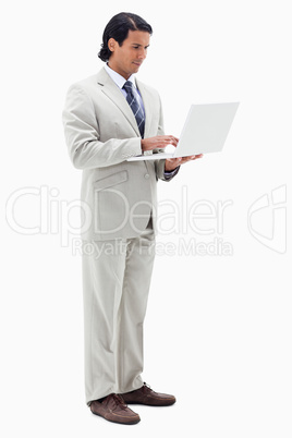 Portrait of a businessman using a notebook