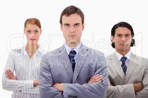 Confident businesspeople with arms folded