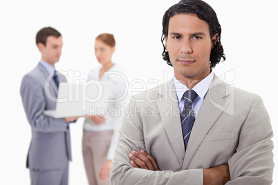 Businessman with colleagues working on laptop