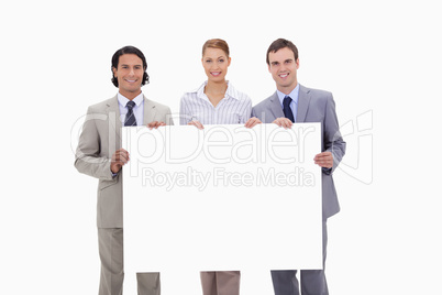 Businessteam holding blank sign