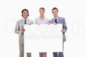 Businessteam holding blank sign