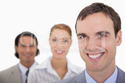 Smiling businessteam standing in a row