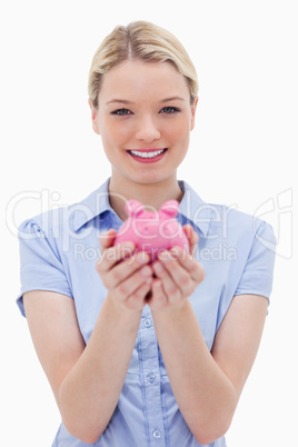 Woman holding piggy bank