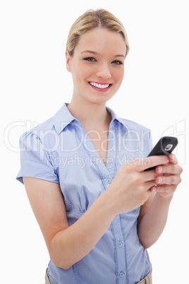 Smiling woman holding her cellphone