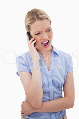 Woman yelling into her phone