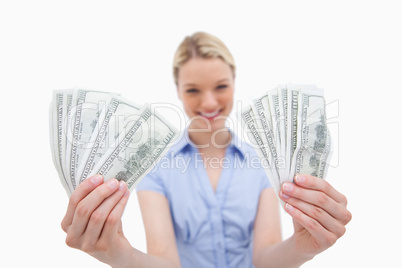 Woman holding money in her hands