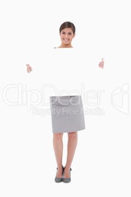 Woman holding blank sign