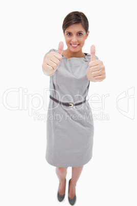 Smiling woman giving thumbs up