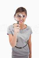 Woman using magnifier