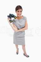 Woman standing with binoculars