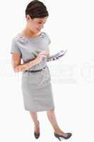 Side view of woman with hand calculator