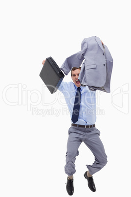 Happy businessman with suitcase jumping