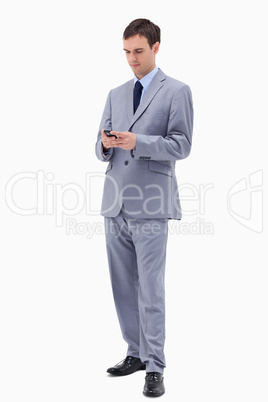 Businessman writing text message