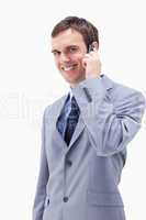 Smiling businessman on the cellphone