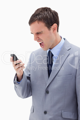 Businessman yelling at his cellphone