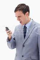 Businessman yelling at his cellphone