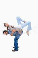 Man lifting his girlfriend on his back