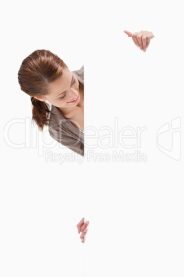 Woman looking at blank sign