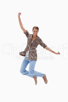 Smiling woman jumping