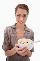 Woman with bowl of fruit salad