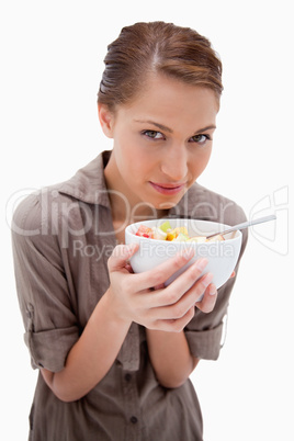 Woman with a bowl of fruit salad