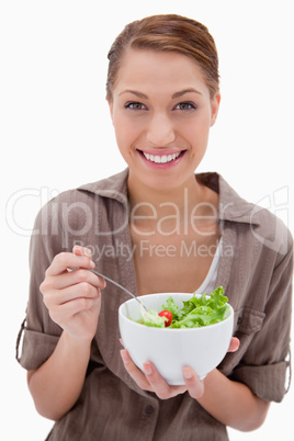 Smiling woman with bowl of salad