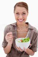 Smiling woman with bowl of salad