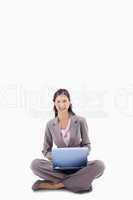 Smiling woman sitting with laptop