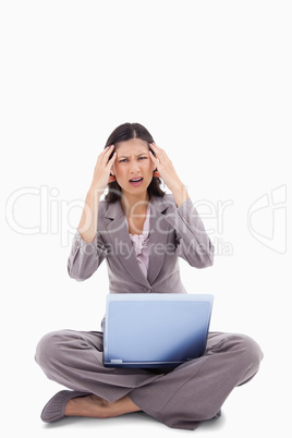 Laptop gives sitting woman a headache