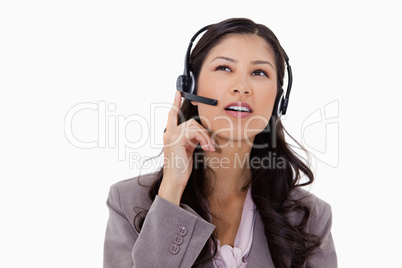 Businesswoman listening to caller with headset