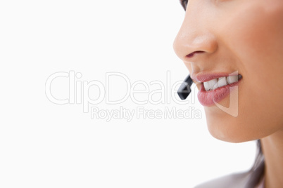 Side view of talking mouth of female call center agent