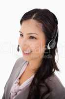 Smiling female call center agent at work