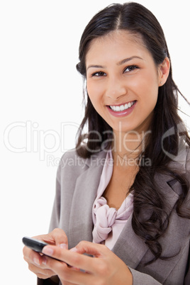 Smiling woman holding cellphone