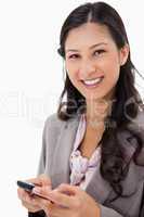 Smiling woman holding cellphone